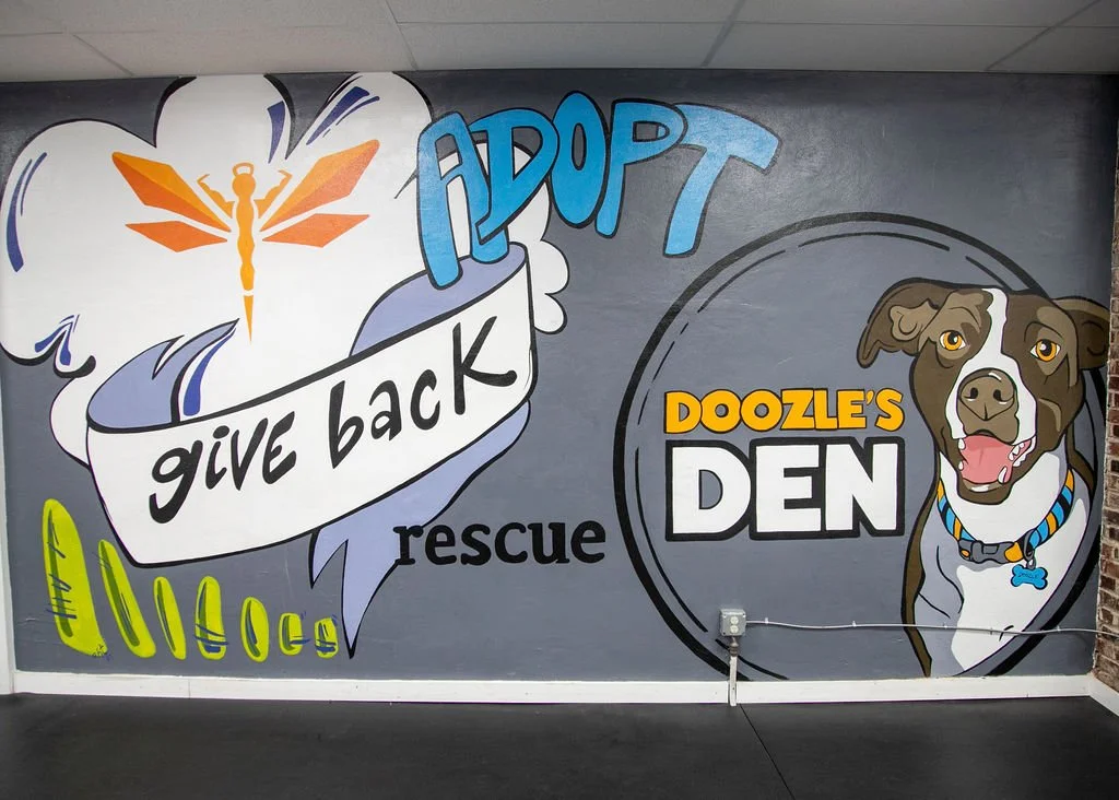 Mural at Doozle’s Den updated 2025 (originally 2021) 196” x 106” (16 1/2 ‘ width x 8 1/2’ height) Photo credit: Erin Henry