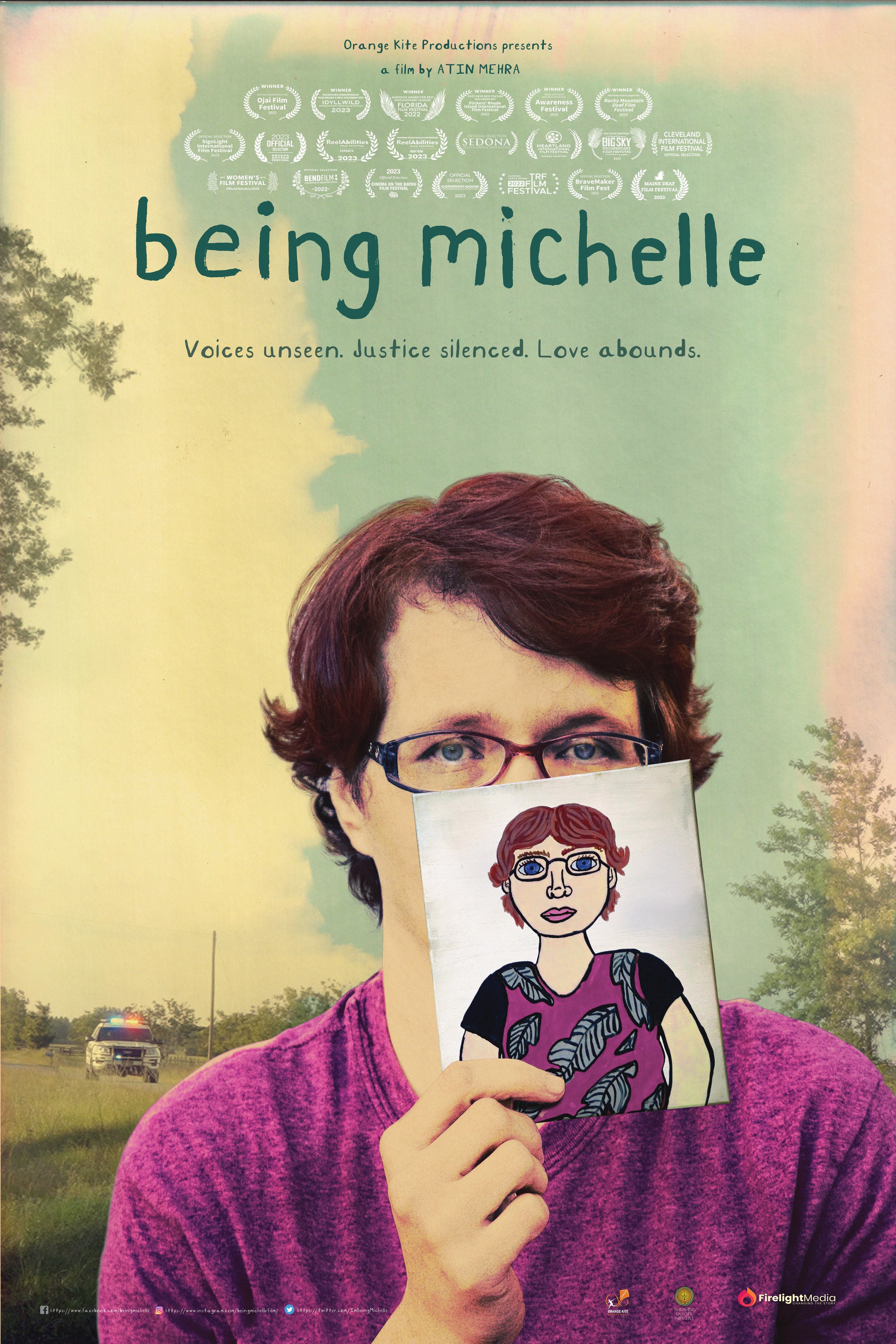 Movie poster for 'Being Michelle' featuring a woman with short red hair, glasses, and a purple shirt holding an illustrated portrait of herself in front of her face. The background shows a grassy field and trees with a police vehicle in the distance. The poster includes various film festival laurels and the tagline 'Voices unseen. Justice silenced. Love abounds.'.
