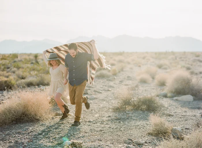 running with a blanket in the desert