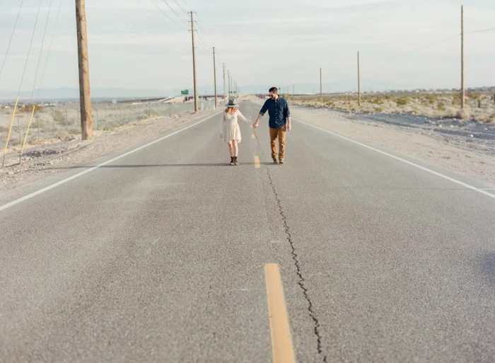 holding hands in the middle of the street engagement