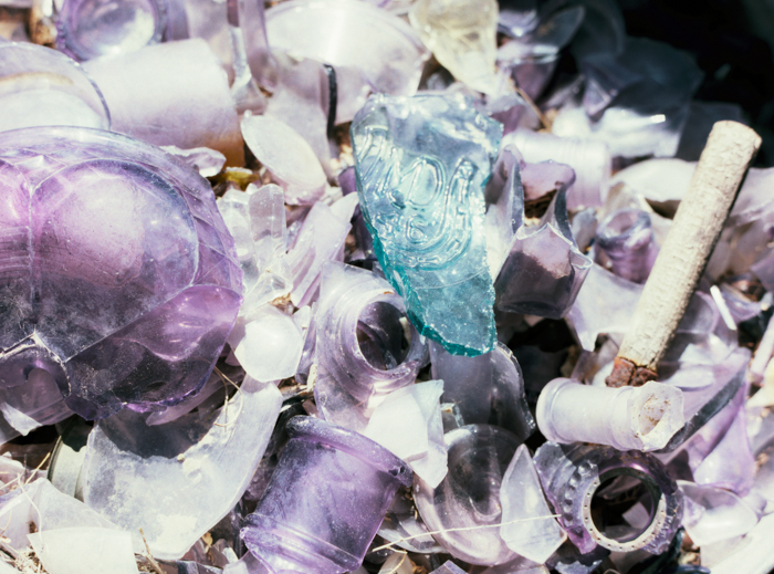 broken purple glass in the desert