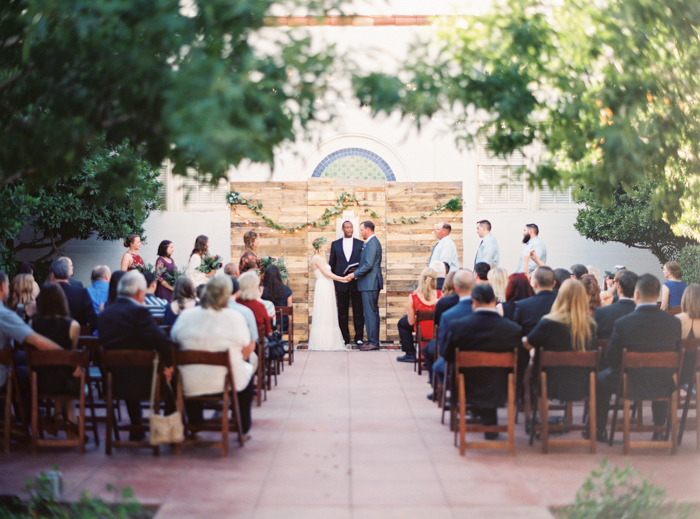 las vegas wedding with boho details reclaimed wood ceremony backdrop