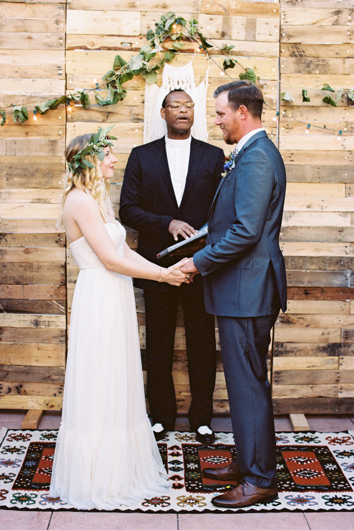 las vegas wedding with boho details photo reclaimed wood backdrop