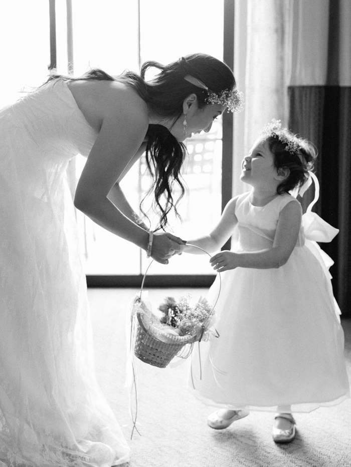 flower girl and bride looking at each other | gaby j photography