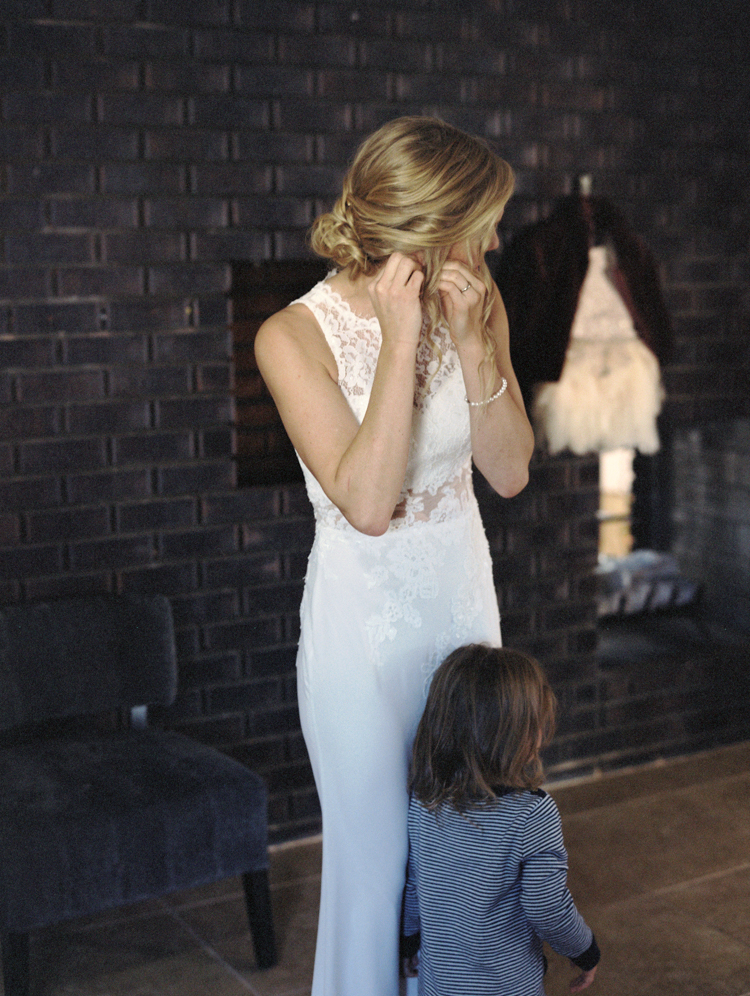 daughter watching mom get ready before wedding ceremony | gaby j photography