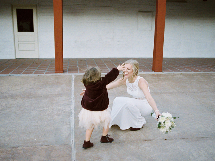 historic fifth street school wedding | gaby j photography | las vegas wedding photographer | family gathering winter wedding inspiration | daughter seeing mom for the first time in dress