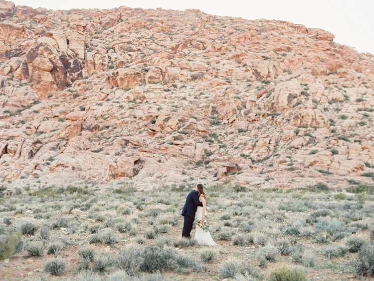 small wedding at red rock canyon national park | desert elopement | gaby j photography | las vegas elopement | danani handmade adornments | opal floral | peachy keen unions