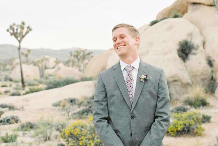 groom seeing bride for the first time smile