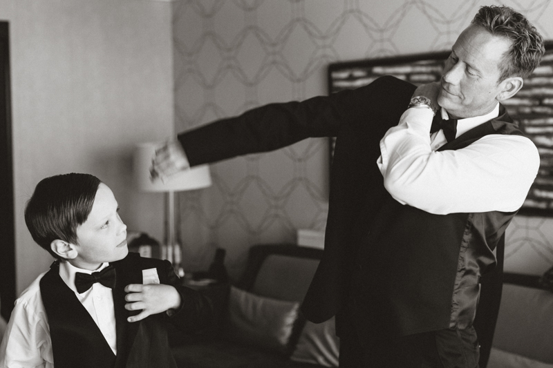 groom and son getting ready before wedding