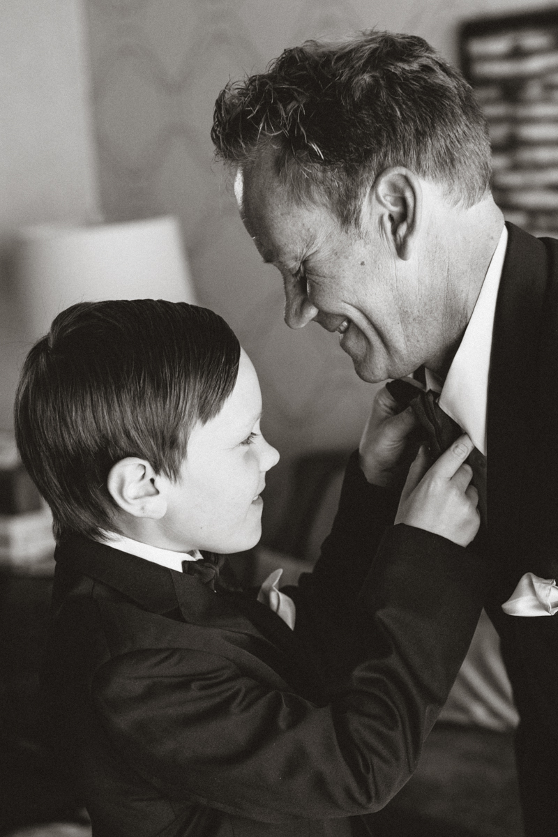 son helping dad with tie