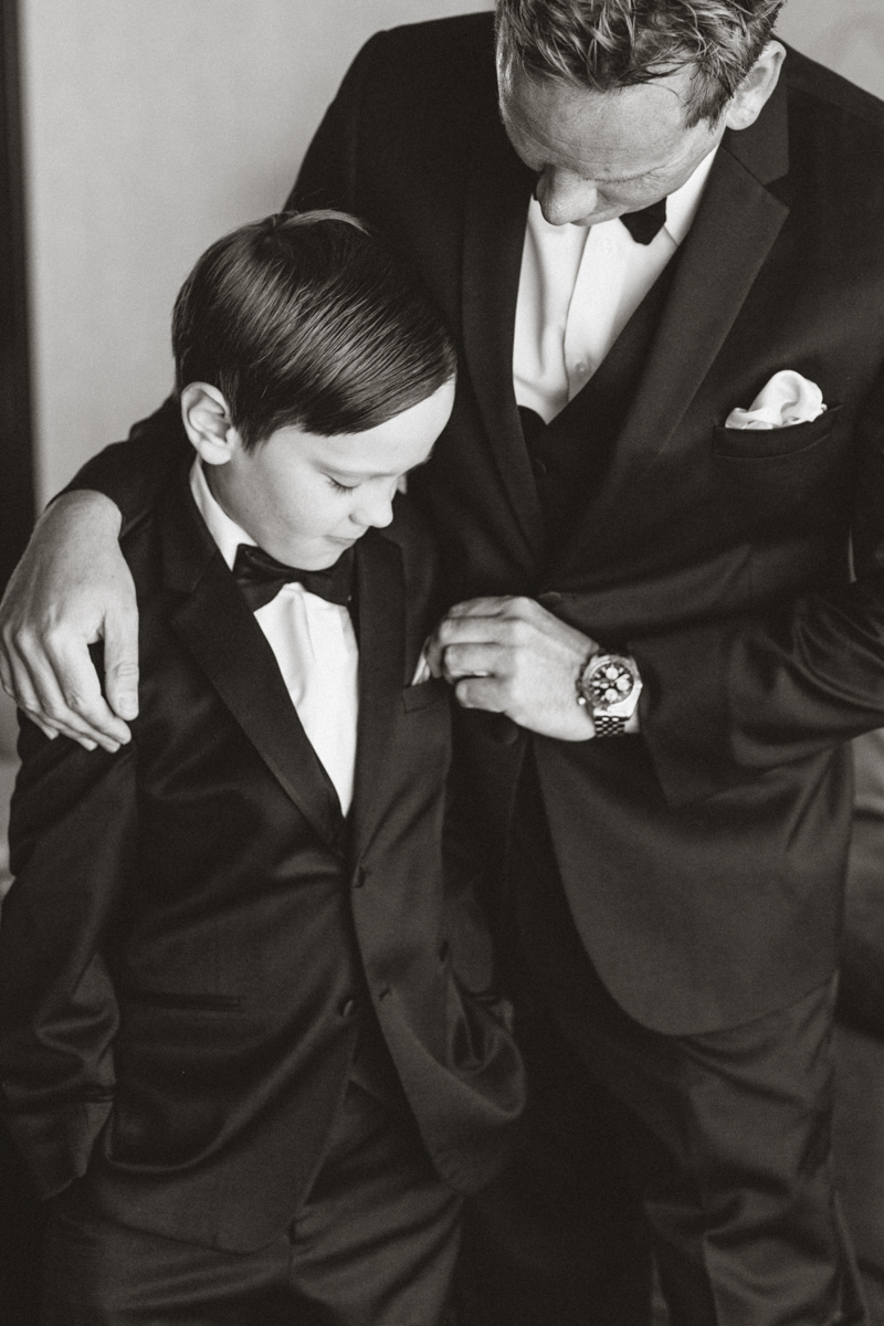 groom and son getting ready before wedding