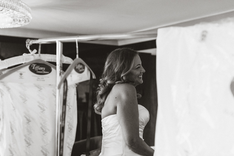 bride smiling while getting ready