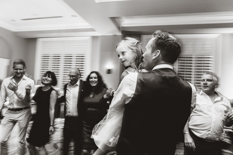 dad dancing with daughter during wedding