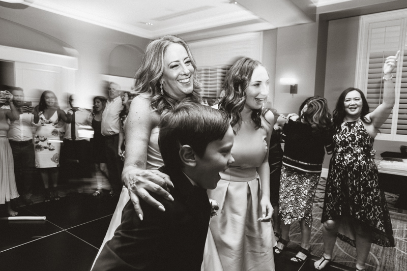 mom dancing with children wedding