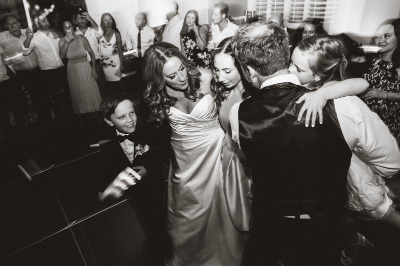 family dancing together during wedding reception