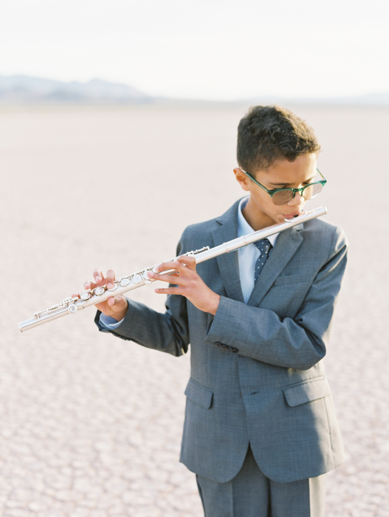 boy playing the flute during wedding ceremony