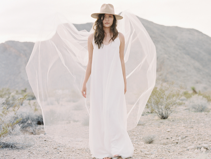 bride wearing cowboy hat and veil