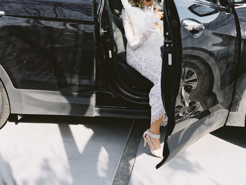 bride getting into car