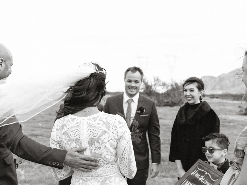 brother giving sister away during ceremony