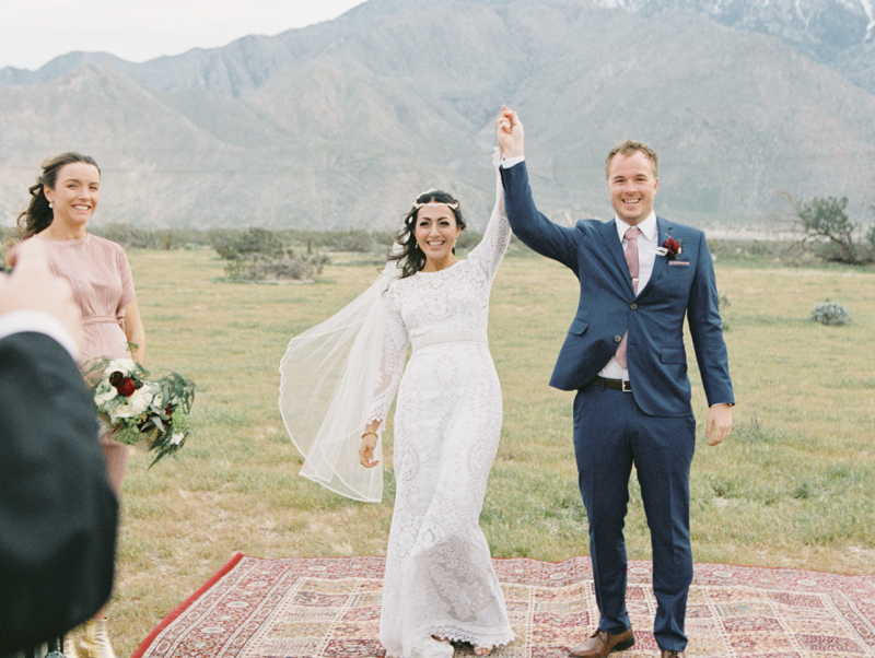 bride and groom walking down the aisle together