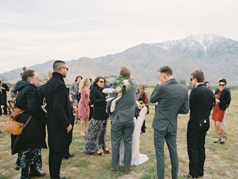 bride hugging guests during wedding