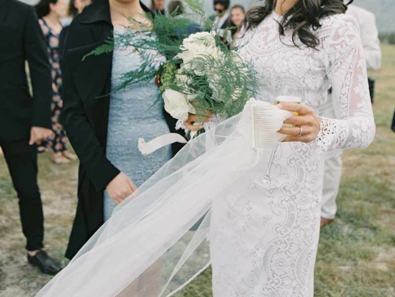 bride holding onto veil