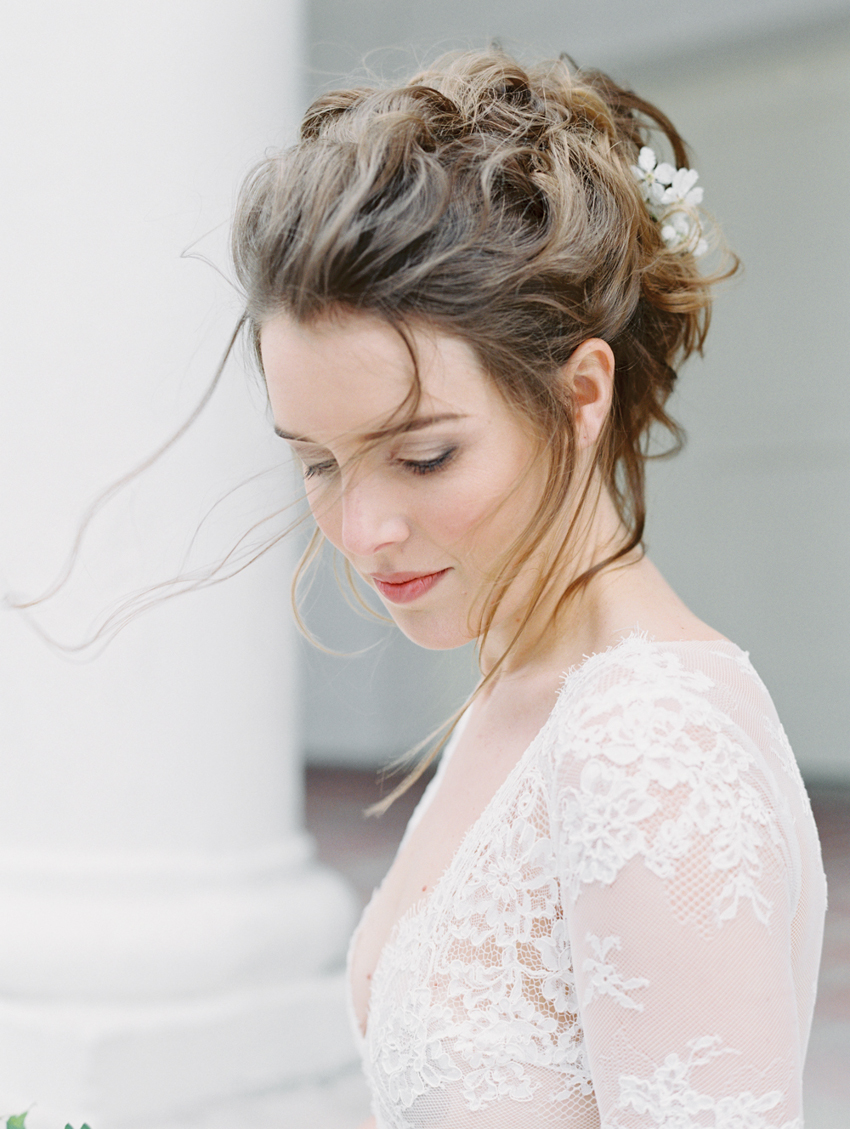 natural bridal updo with flowers in hair
