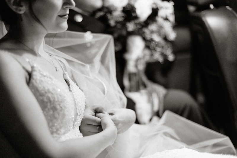 bride and groom riding in car together