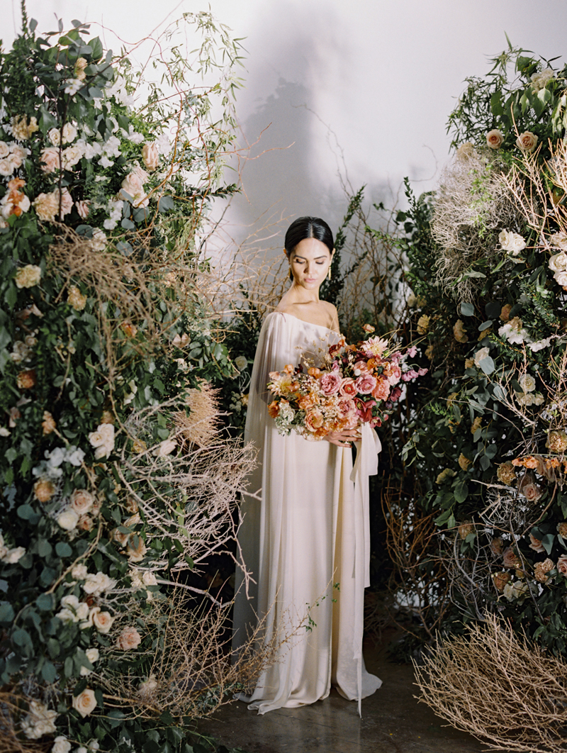 runway wedding inspiration with flower bomb arch