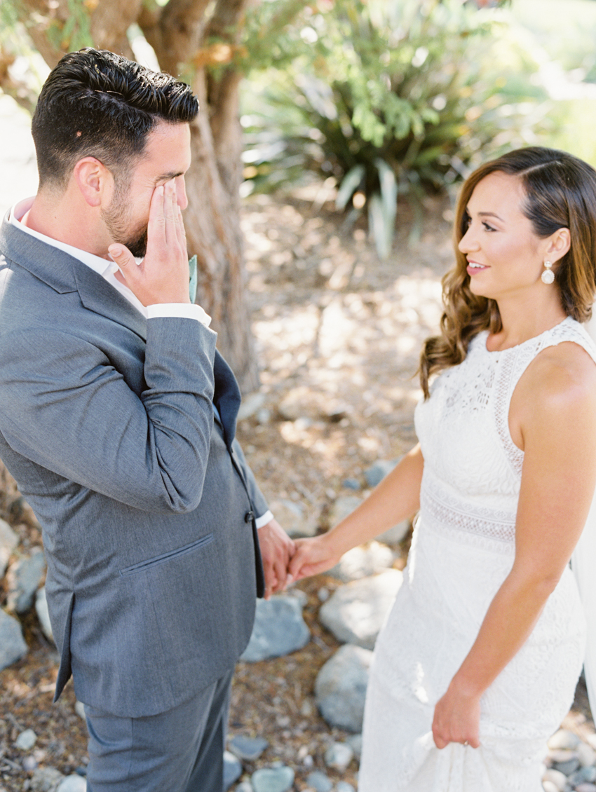 groom crying during first look photos