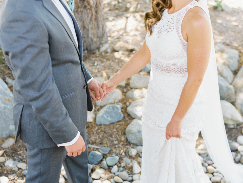 bride and groom holding hands