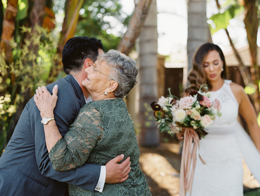 groom hugging grandma emotional moment