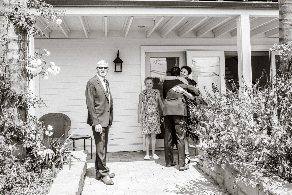 groom hugging mom