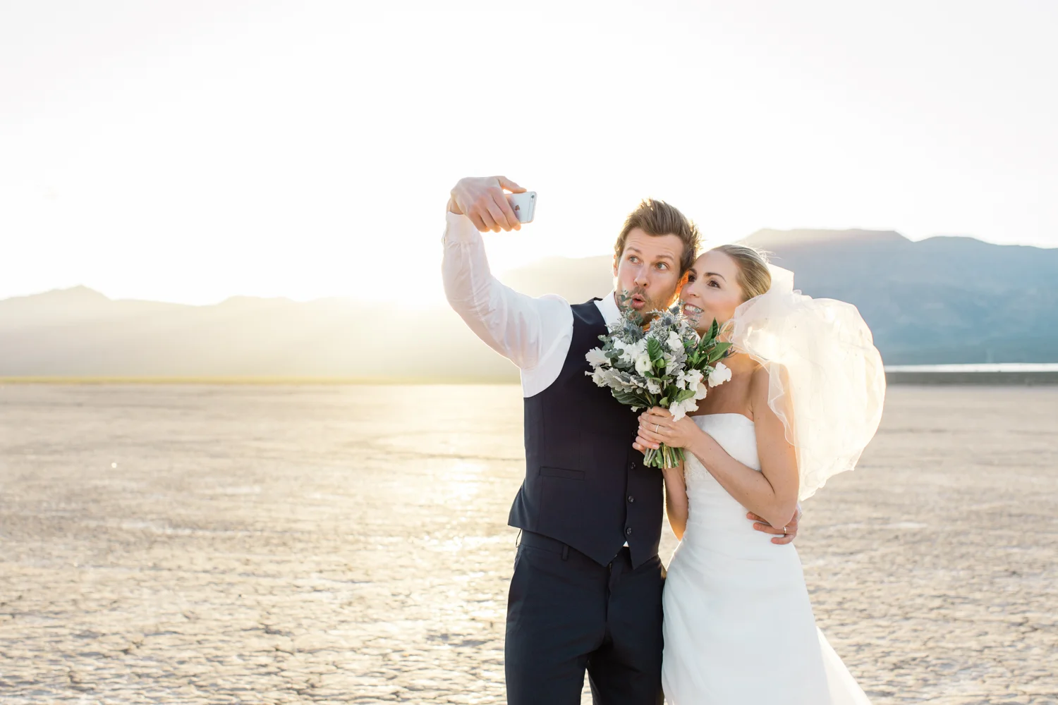 bride and groom taking a selfie