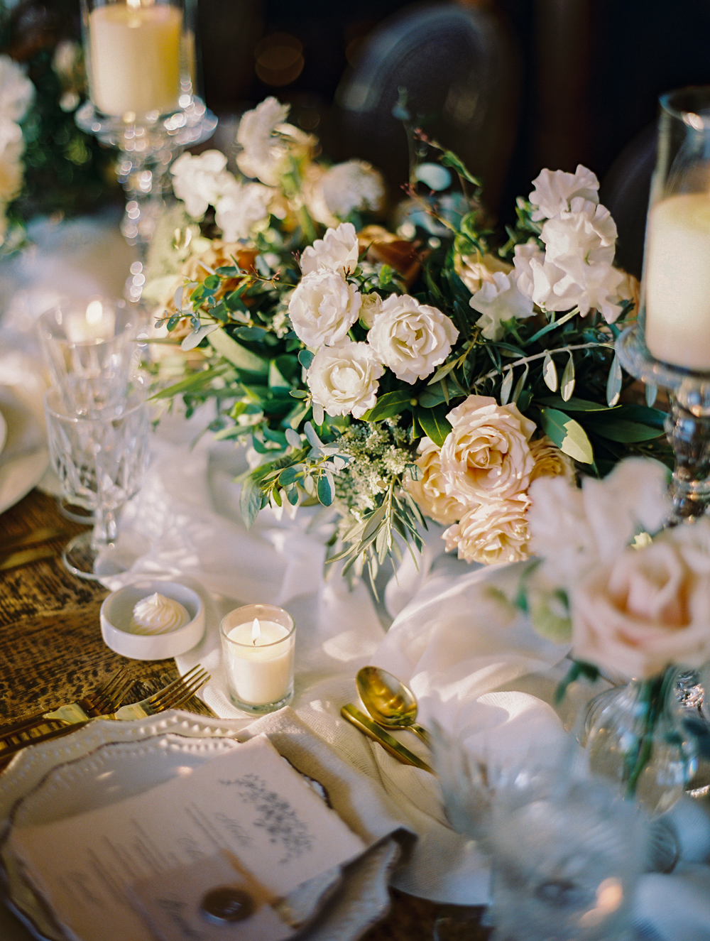 romantic wedding reception with candles and garden florals