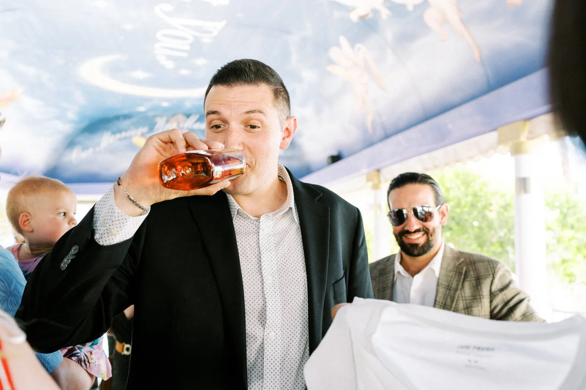 groom drinking right after the ceremony