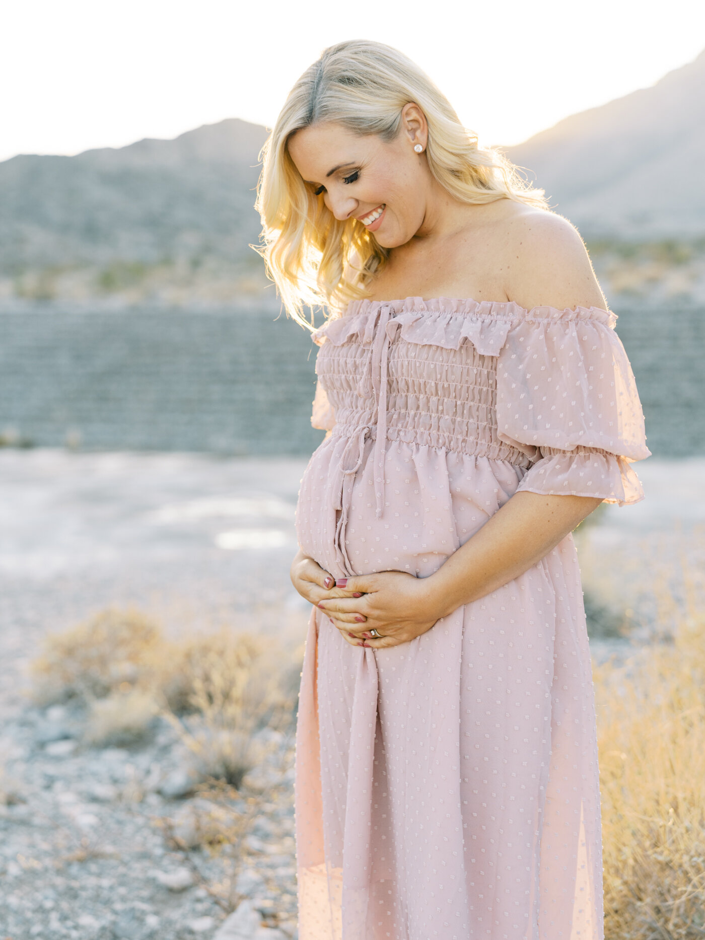 maternity photography wearing pink dress