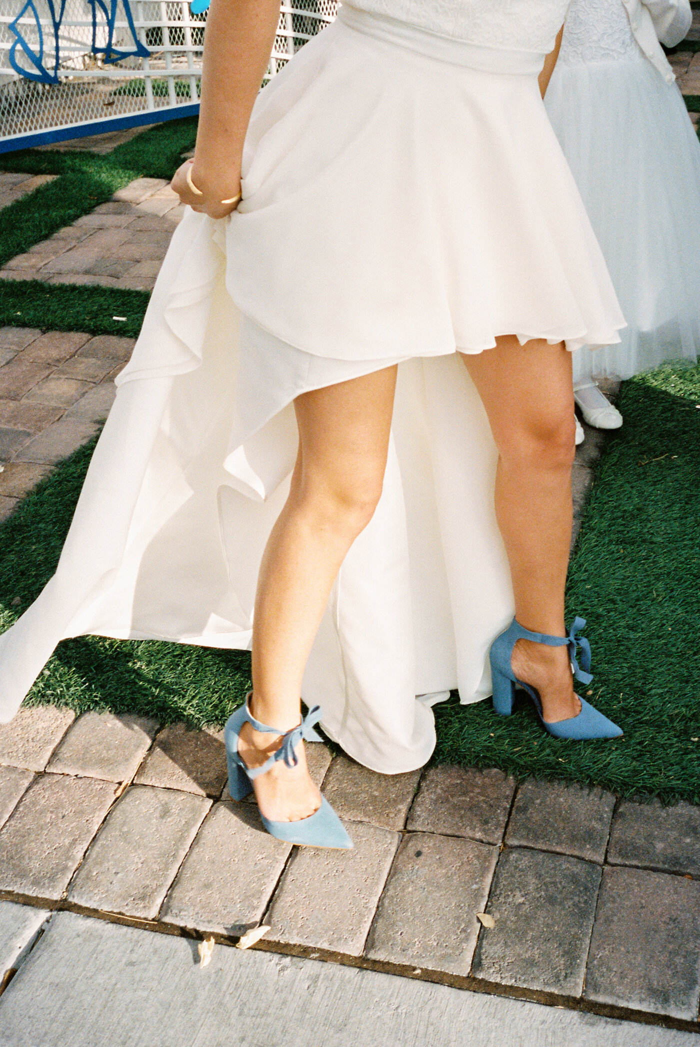bride wearing blue suede heels