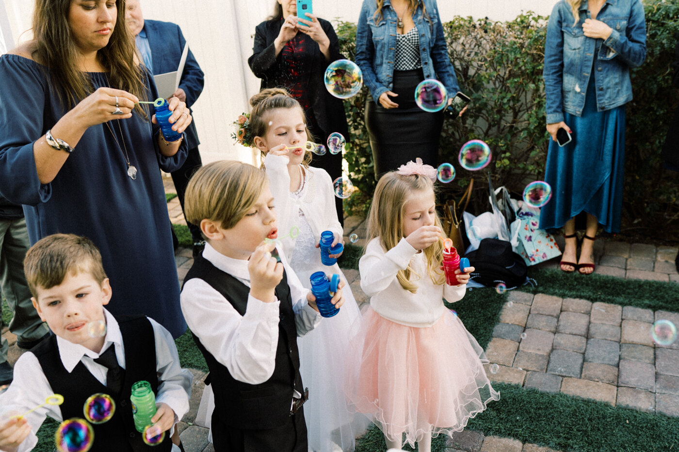 wedding guests blowing bubbles