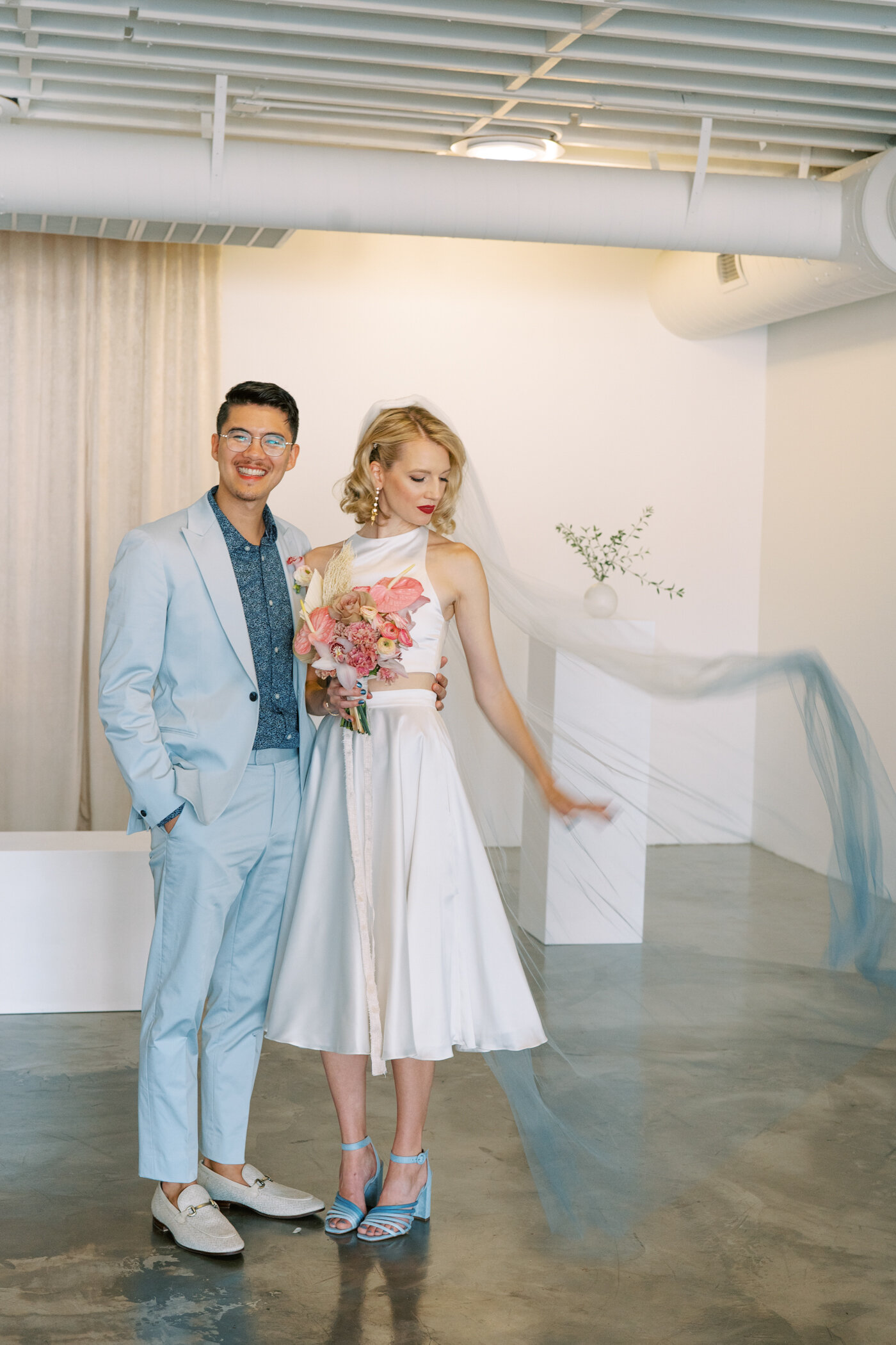 bride wearing blue ombre veil