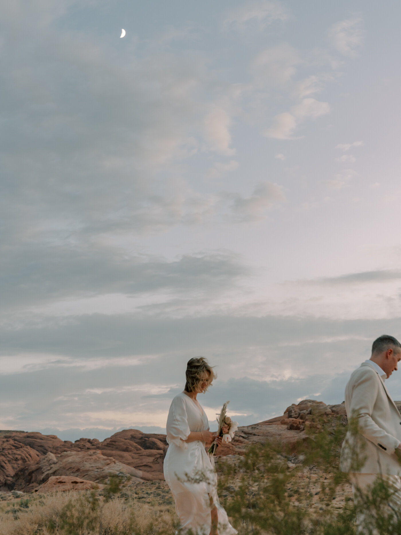 bride and groom walking valley of fire