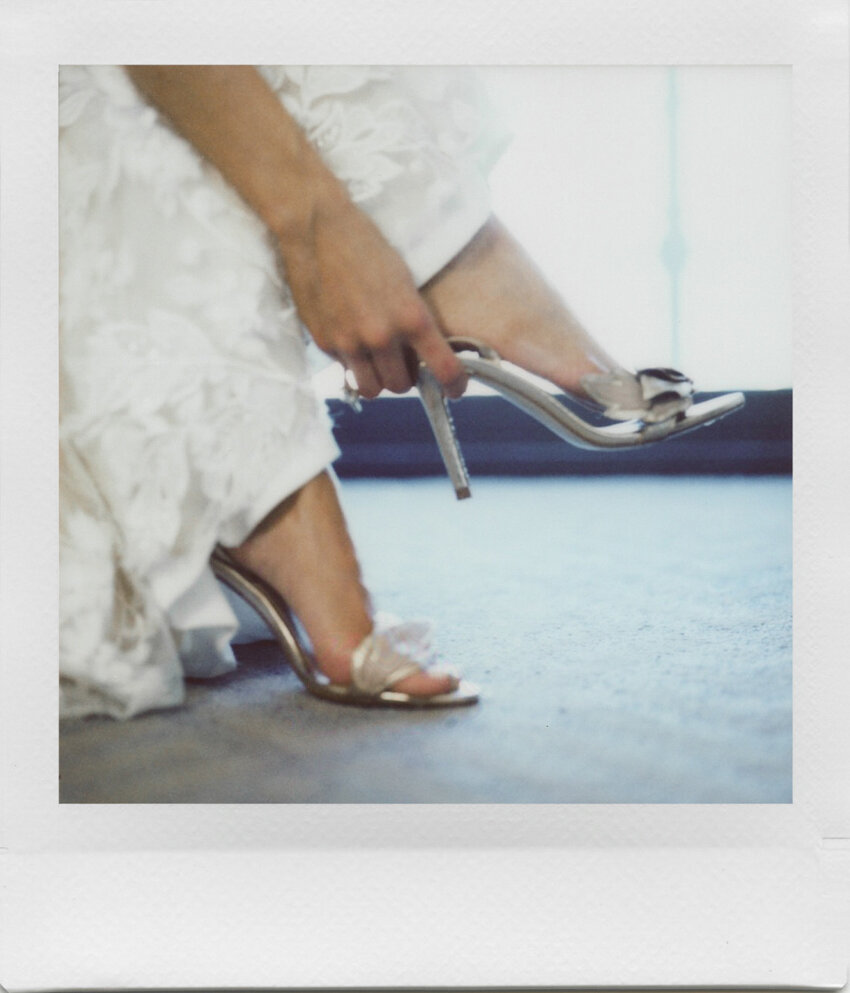 bride putting on shoe