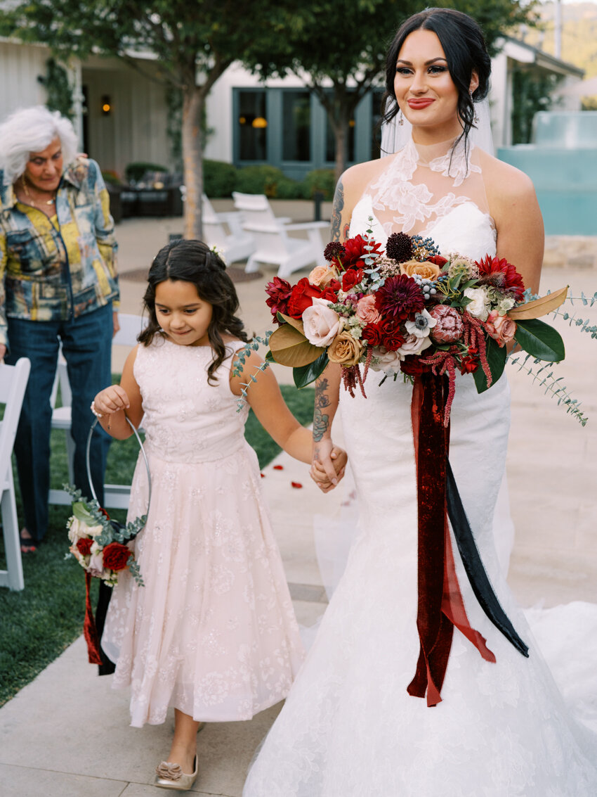 daughter walking bride mom down the aisle