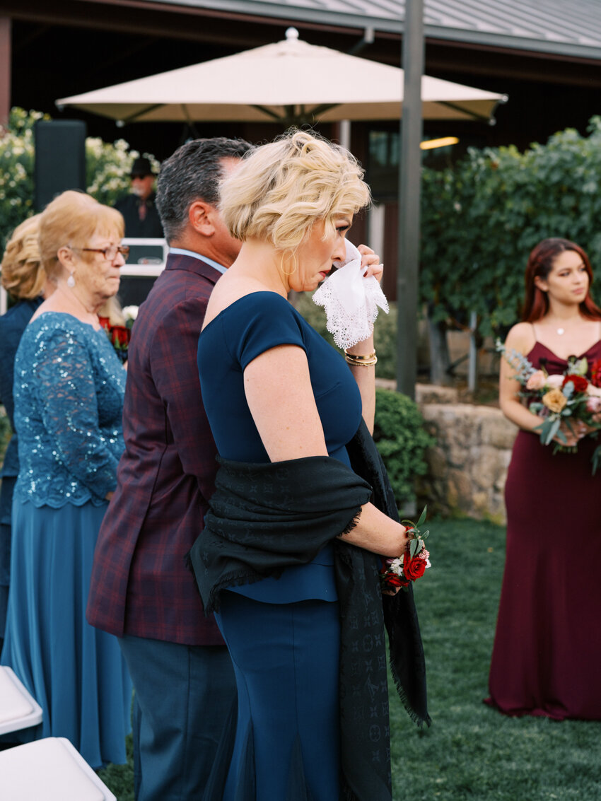 mother of the bride crying during ceremony