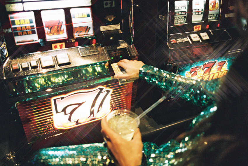 bride and groom gambling on slot machines