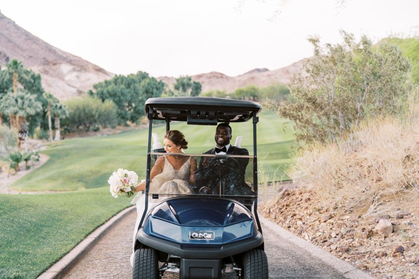 bride and groom driving golf cart