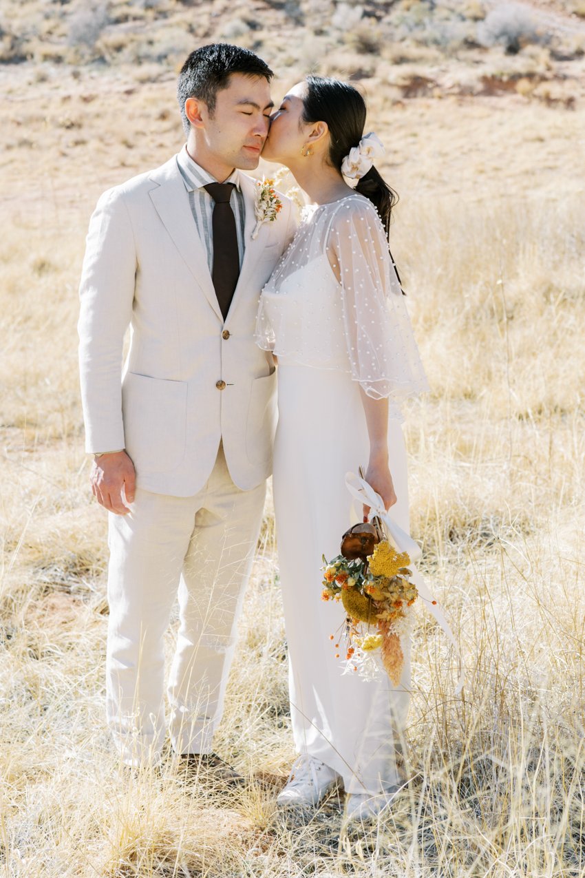 bride wore a white scrunchie and casual white sneakers