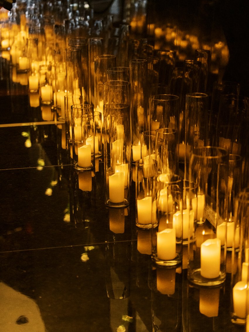lit candles in hallway wedding