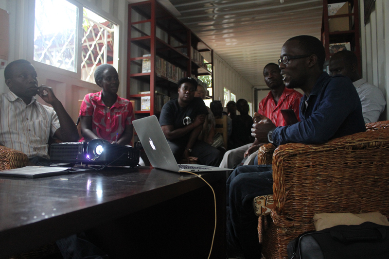 Artist Benon Lutaaya gives an artist talk in the library at 32° East