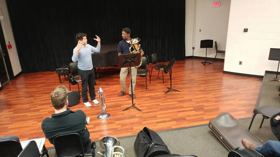 Working with a student in a masterclass at Kennesaw State University